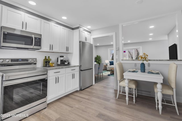 402 Picardy Ct Unit B, Lakewood, NJ 08701 - kitchen featuring stainless steel appliances, light wood finished floors, white cabinetry, and recessed lighting