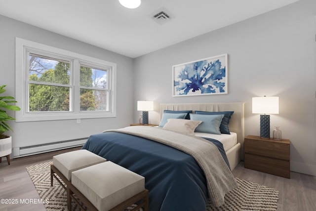402 Picardy Ct Unit B, Lakewood, NJ 08701 - bedroom with a baseboard radiator and light wood finished floors