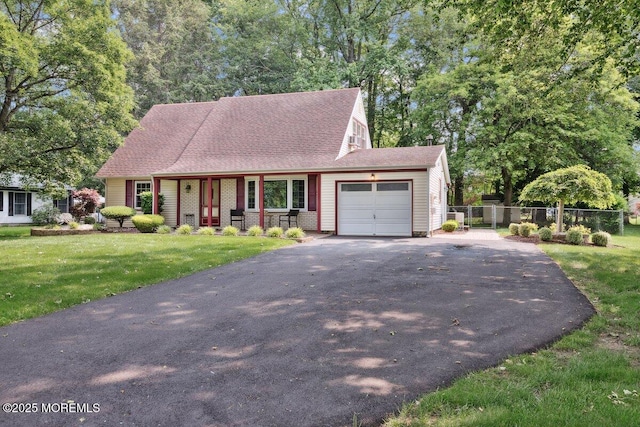 10 Patterson Ln, Manalapan, NJ 07726 - view of front of property featuring driveway, an attached garage, a porch, and a shingled roof