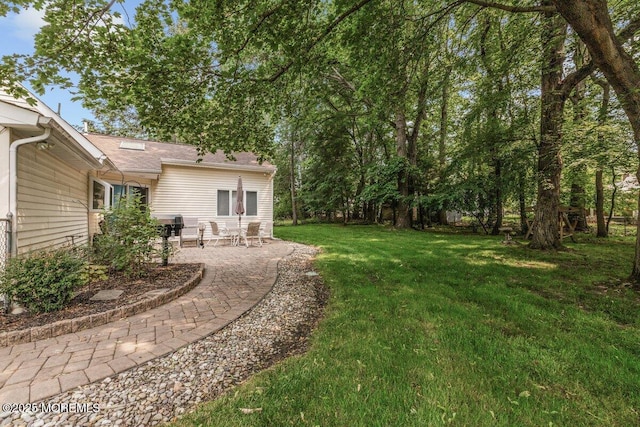 10 Patterson Ln, Manalapan, NJ 07726 - view of green lawn featuring a patio area