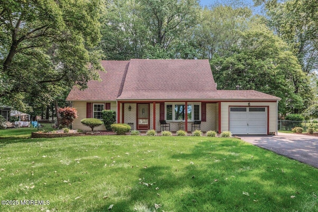 10 Patterson Ln, Manalapan, NJ 07726 - view of front facade featuring asphalt driveway, a garage, a porch, and roof with shingles