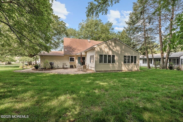 10 Patterson Ln, Manalapan, NJ 07726 - back of house with a lawn and a patio area