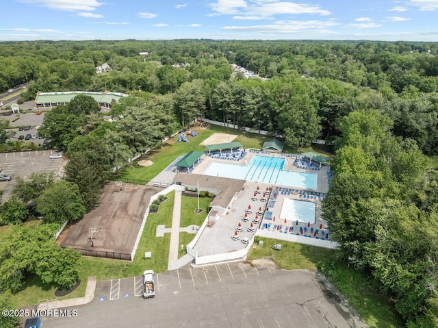 10 Patterson Ln, Manalapan, NJ 07726 - drone / aerial view of a heavily wooded area and a pool