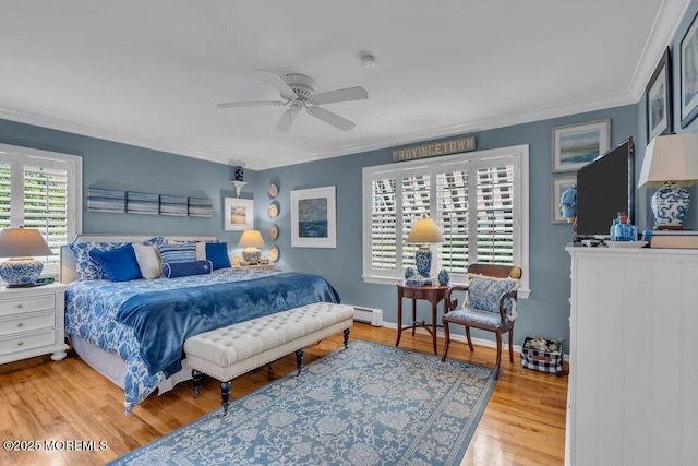 616 Valley Rd, Brielle, NJ 08730 - bedroom with ornamental molding, wood finished floors, a baseboard heating unit, and ceiling fan