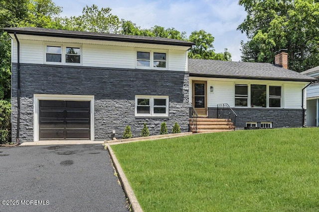 1528 Stuyvesant Ave, Ewing, NJ 08618 - tri-level home featuring stone siding, a front lawn, an attached garage, a chimney, and driveway