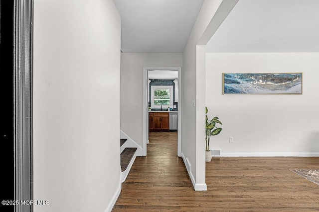 1528 Stuyvesant Ave, Ewing, NJ 08618 - hallway with dark wood-type flooring and baseboards