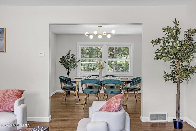 1528 Stuyvesant Ave, Ewing, NJ 08618 - dining space featuring wood finished floors and a chandelier