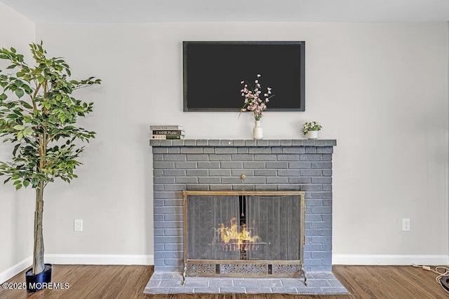 1528 Stuyvesant Ave, Ewing, NJ 08618 - detailed view of wood finished floors and a brick fireplace