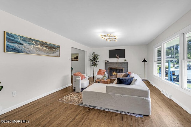 1528 Stuyvesant Ave, Ewing, NJ 08618 - living area with wood finished floors and a brick fireplace