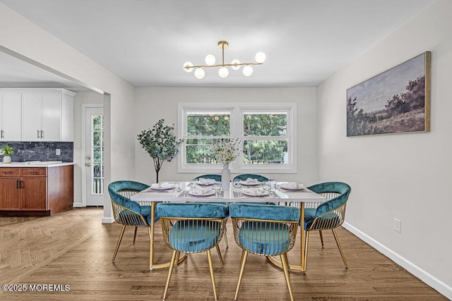1528 Stuyvesant Ave, Ewing, NJ 08618 - dining area featuring a chandelier and wood finished floors