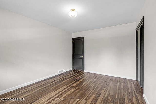 1528 Stuyvesant Ave, Ewing, NJ 08618 - empty room featuring dark wood-type flooring and baseboards