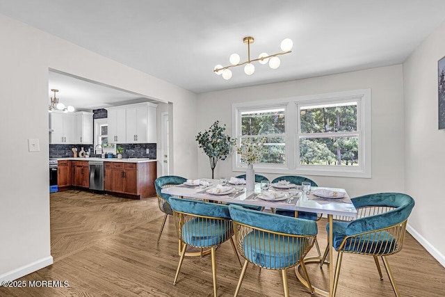 1528 Stuyvesant Ave, Ewing, NJ 08618 - dining space featuring a chandelier and parquet flooring