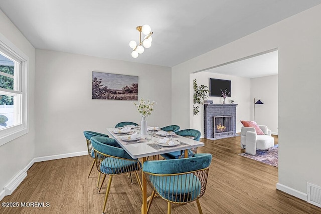1528 Stuyvesant Ave, Ewing, NJ 08618 - dining space featuring wood finished floors and a fireplace