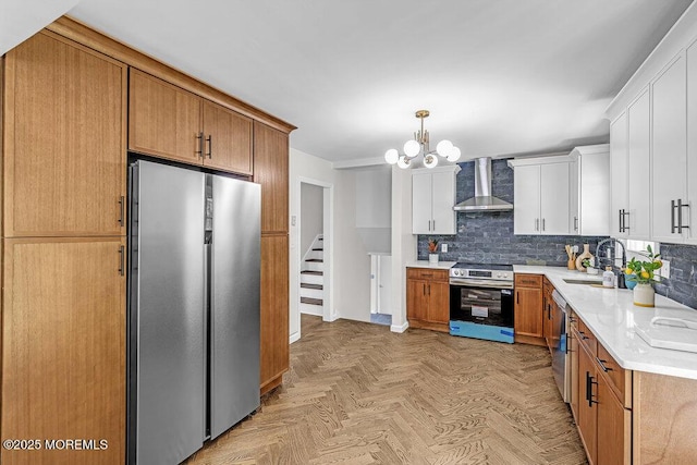 1528 Stuyvesant Ave, Ewing, NJ 08618 - kitchen with stainless steel appliances, wall chimney range hood, light countertops, tasteful backsplash, and white cabinets