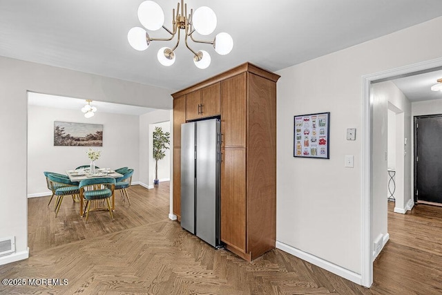 1528 Stuyvesant Ave, Ewing, NJ 08618 - kitchen with freestanding refrigerator, a chandelier, and brown cabinets