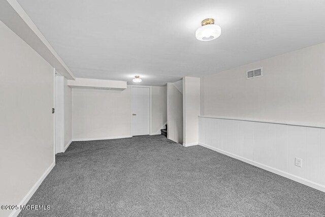 1528 Stuyvesant Ave, Ewing, NJ 08618 - finished basement with carpet floors, stairs, and a wainscoted wall