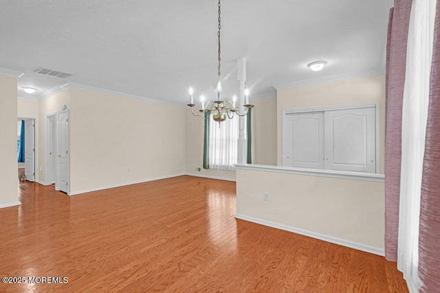 29 Goldenedge Way, Lakewood, NJ 08701 - empty room featuring a chandelier, crown molding, and light wood finished floors