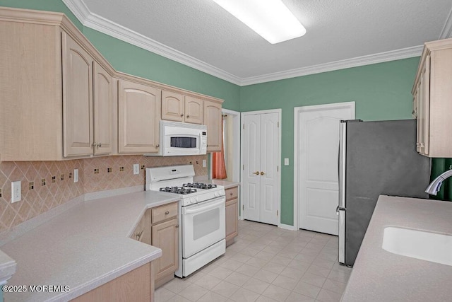 29 Goldenedge Way, Lakewood, NJ 08701 - kitchen with white appliances, crown molding, light brown cabinetry, light tile patterned floors, and light countertops