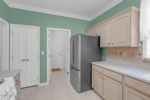 29 Goldenedge Way, Lakewood, NJ 08701 - kitchen featuring freestanding refrigerator, stove, light countertops, crown molding, and backsplash