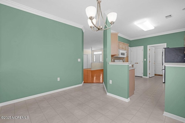 29 Goldenedge Way, Lakewood, NJ 08701 - kitchen with white microwave, light countertops, crown molding, a chandelier, and freestanding refrigerator