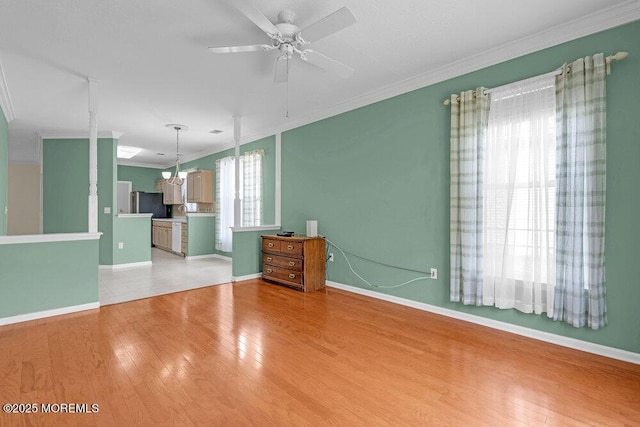 29 Goldenedge Way, Lakewood, NJ 08701 - unfurnished living room with ornamental molding, a ceiling fan, and light wood-type flooring