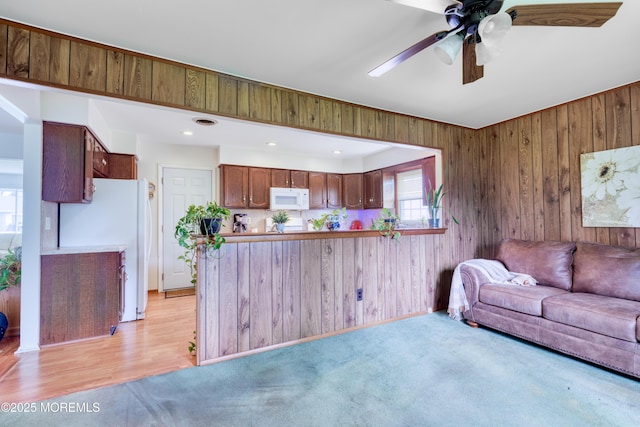 5 Bennington Dr, Toms River, NJ 08757 - living area featuring a ceiling fan, wooden walls, and light colored carpet