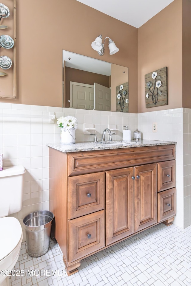 5 Bennington Dr, Toms River, NJ 08757 - bathroom with tile walls, vanity, and wainscoting