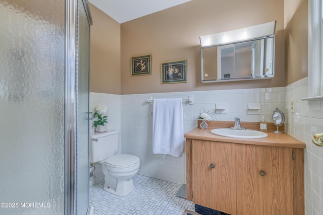 5 Bennington Dr, Toms River, NJ 08757 - bathroom featuring tile walls, vanity, a stall shower, tile patterned floors, and wainscoting