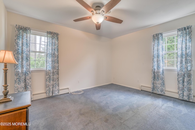 5 Bennington Dr, Toms River, NJ 08757 - empty room featuring plenty of natural light, a baseboard heating unit, ceiling fan, and carpet flooring