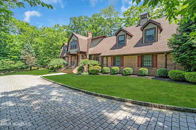 8 Old Dutch Rd, Warren, NJ 07059 - view of front of house featuring a chimney, a shingled roof, brick siding, and a front lawn