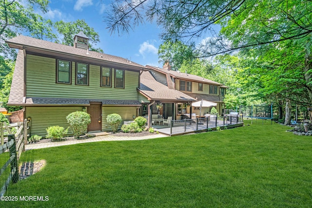 8 Old Dutch Rd, Warren, NJ 07059 - rear view of house featuring a trampoline, a patio area, a chimney, and roof with shingles