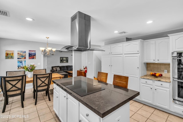 8 Old Dutch Rd, Warren, NJ 07059 - kitchen featuring black electric stovetop, island range hood, light tile patterned floors, recessed lighting, and a chandelier