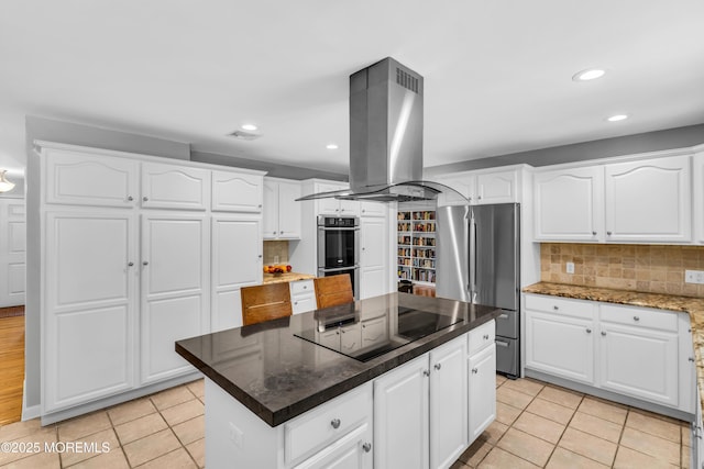 8 Old Dutch Rd, Warren, NJ 07059 - kitchen with stainless steel appliances, island range hood, light tile patterned floors, backsplash, and recessed lighting