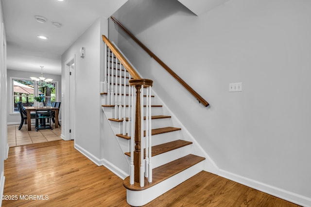 8 Old Dutch Rd, Warren, NJ 07059 - stairway with wood finished floors, a chandelier, and recessed lighting