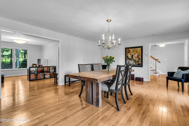 8 Old Dutch Rd, Warren, NJ 07059 - dining room with stairway, light wood-style floors, and a chandelier