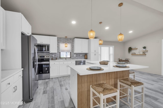 3 Casey Ct, Barnegat, NJ 08005 - kitchen with appliances with stainless steel finishes, healthy amount of natural light, a kitchen bar, light countertops, and recessed lighting