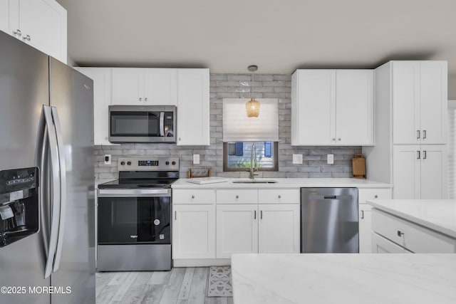 3 Casey Ct, Barnegat, NJ 08005 - kitchen with appliances with stainless steel finishes, white cabinets, and decorative backsplash
