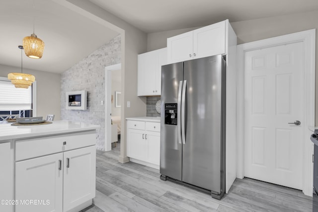3 Casey Ct, Barnegat, NJ 08005 - kitchen featuring stainless steel refrigerator with ice dispenser, lofted ceiling, white cabinetry, light countertops, and light wood-type flooring