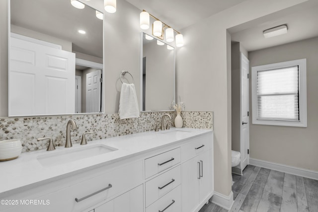 3 Casey Ct, Barnegat, NJ 08005 - bathroom with double vanity, backsplash, wood finished floors, and recessed lighting