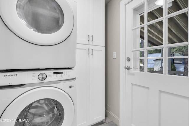 3 Casey Ct, Barnegat, NJ 08005 - laundry room featuring cabinet space and stacked washer / drying machine