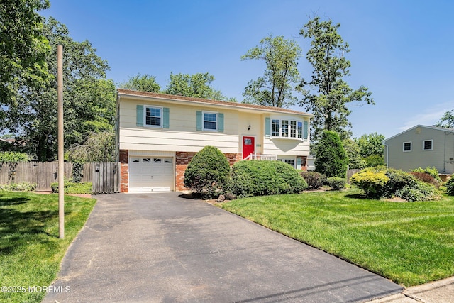 235 Long Branch Ave, Bayville, NJ 08721 - raised ranch featuring asphalt driveway, a garage, and brick siding
