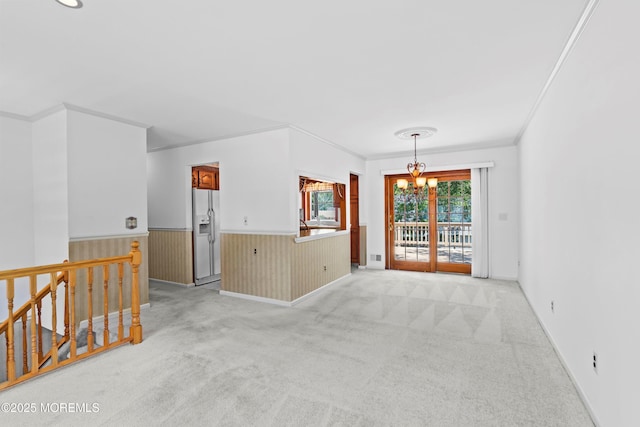 235 Long Branch Ave, Bayville, NJ 08721 - empty room featuring ornamental molding, a chandelier, light carpet, and a wainscoted wall