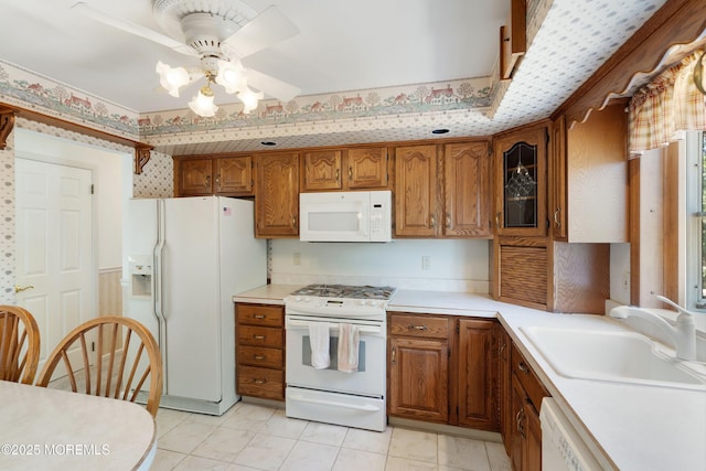 235 Long Branch Ave, Bayville, NJ 08721 - kitchen featuring white appliances, brown cabinets, a ceiling fan, light countertops, and wallpapered walls