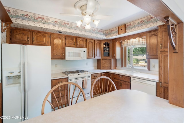 235 Long Branch Ave, Bayville, NJ 08721 - kitchen featuring white appliances, brown cabinets, and light countertops