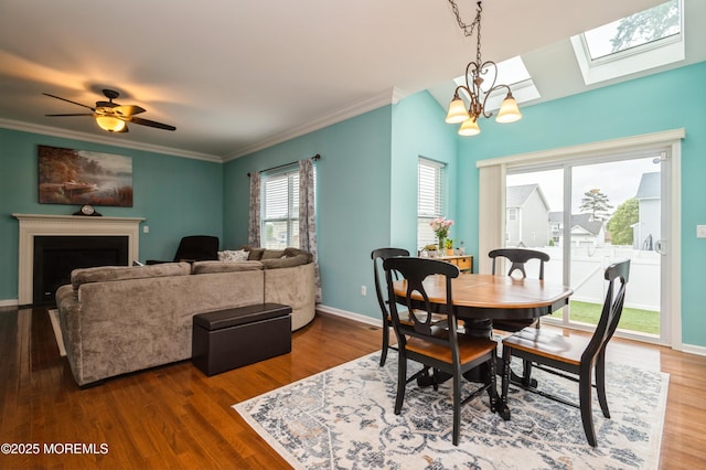 96 Bridle Path, Bayville, NJ 08721 - dining area with a skylight, ornamental molding, wood finished floors, and a fireplace
