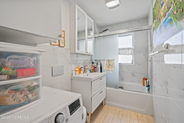 131 W 3rd St, Howell, NJ 07731 - bathroom featuring vanity, bath / shower combo with glass door, washer / clothes dryer, and wood finished floors