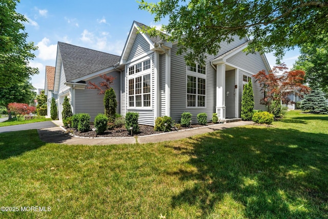 57 Mirage Blvd, Barnegat, NJ 08005 - view of front of home with a front yard, roof with shingles, and a garage