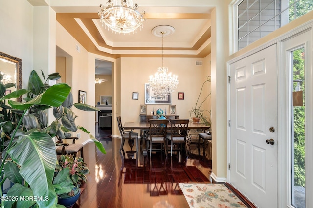 57 Mirage Blvd, Barnegat, NJ 08005 - dining space with a chandelier, wood-type flooring, and a tray ceiling