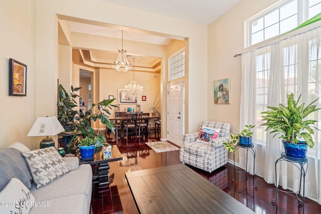 57 Mirage Blvd, Barnegat, NJ 08005 - living room with a chandelier, wood finished floors, and a raised ceiling