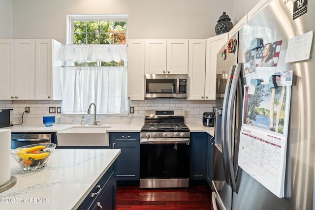 57 Mirage Blvd, Barnegat, NJ 08005 - kitchen featuring stainless steel appliances, decorative backsplash, dark wood-type flooring, and blue cabinets